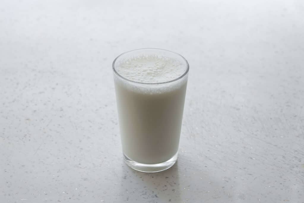 glass filled with milk