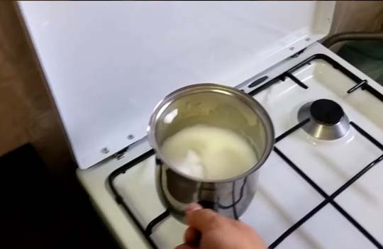 steaming milk at stovetop