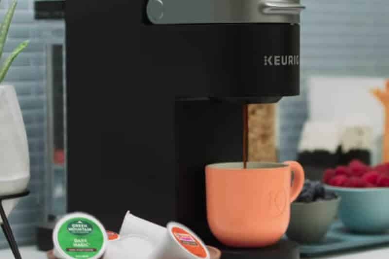                                                 Keurig machine dispensing freshly brewed coffee
